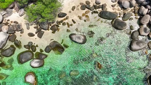 A drone is flying over a stunning beach on a tropical island. 4K.