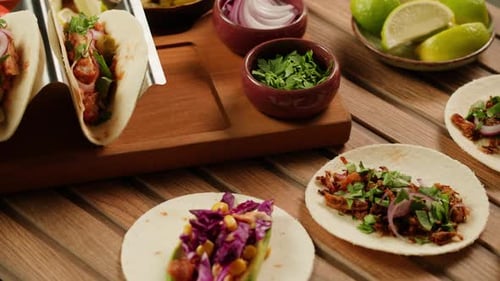 Ingredients and Tacos on a Wooden Table