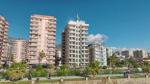Drone Footage in White Beachfront Building and Azure Sea