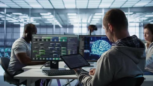 People Working with Computers in a Bright Modern Office