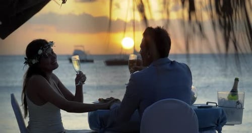 Romantic Beach Wedding Champagne Toast at Sunset
