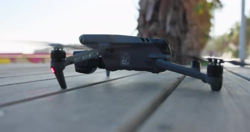 Motionless DJI Mavic 3 Pro drone on wooden table