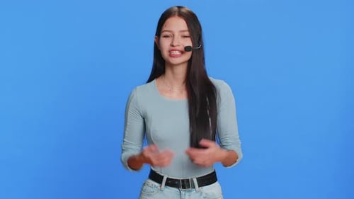 Young Woman Freelance Worker in Headset Call Center Support Service Operator Helpline Having Talk