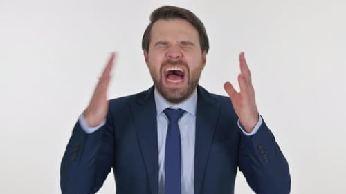 Frustrated Middle Aged Businessman Screaming Loud on White Background