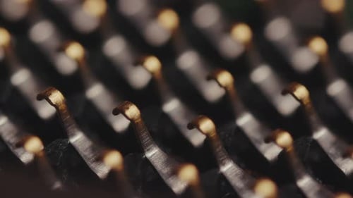 Rows of Shiny Metal Pins in Macro