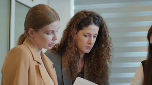 Confused working team looking for the error in documents for important client.