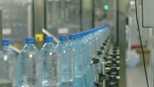 Working Conveyor with Bottles of Distilled Water