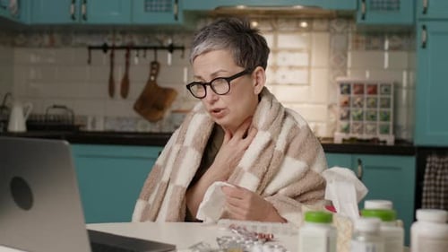 Adult Video Calling with Doctor in Kitchen