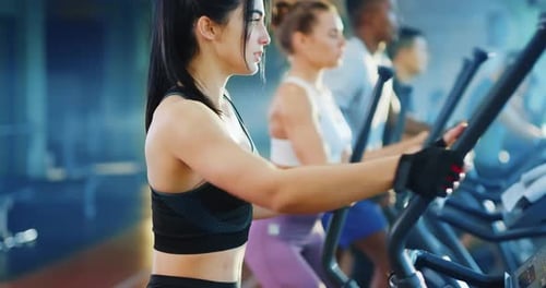 Women Actively Exercising in the Gym A Focused and Committed Fitness Lifestyle Journey