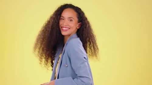 Natural, hair and face of black woman in studio happy, playful and having fun against yellow