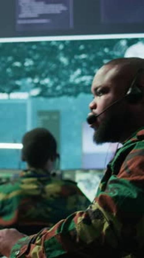 Vertical Video Government Intelligence Officer in High Tech Command Post Oversee Satellite Data