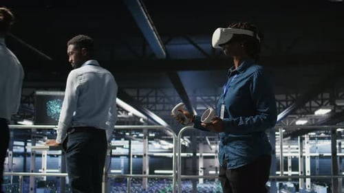Engineer in Data Center Analyzing Performance Outputs Using Virtual Reality