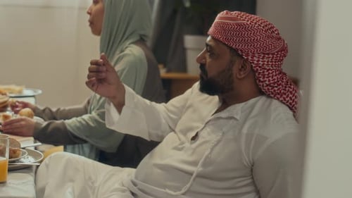 People Eating Together at Family Meal Indoors