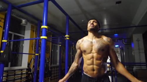 Strong Athlete with Tattoos Skipping with a Jump Rope at Sport Club Young Sporty Man Doing Cardio at