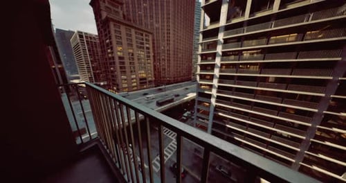 Urban Balcony View During Twilight in a Bustling City