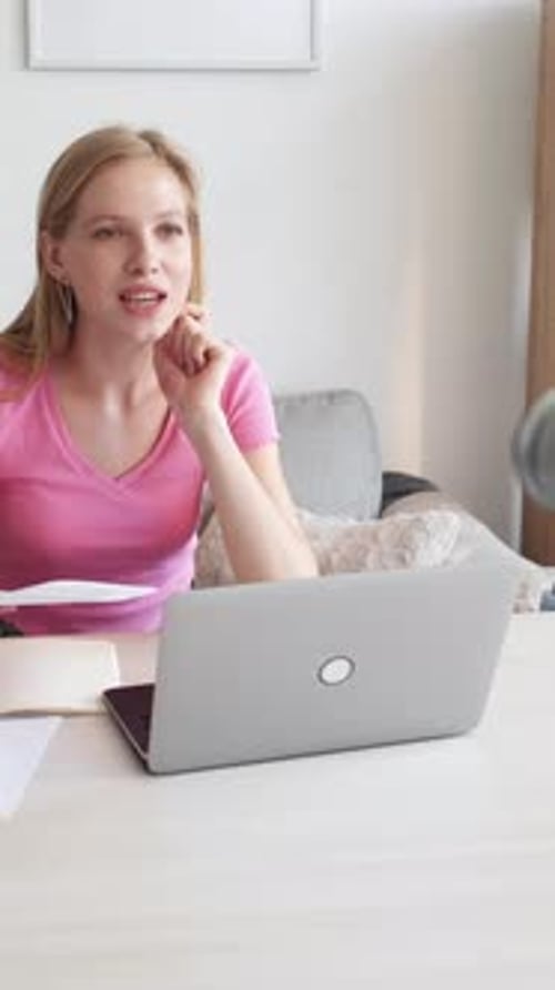 Woman Working at Desk on Video Call