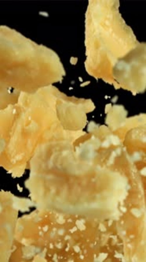 Parmesan Cheese Flies Up and Falls Down Filmed on a Highspeed Camera at 1000 Fps