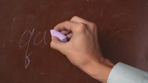 Hand Writing Quarantine with Chalk, Crossed Out