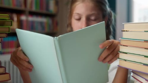 Tired Caucasian Little Girl Kid Child Holding Textbook Reading Literature Put Copybook on Table