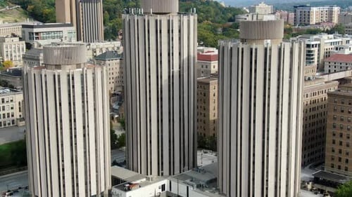 Tall circular 1960s style dormitory buildings at college campus and student housing in Pittsburgh PA