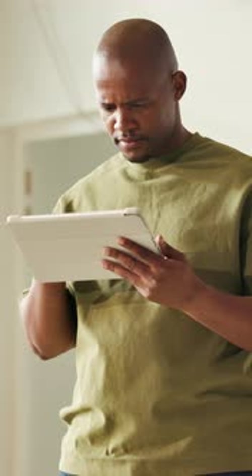 Black man, tablet and thinking in home for renovation, construction or interior design with vision