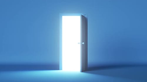 bright white light shining behind the opening door
