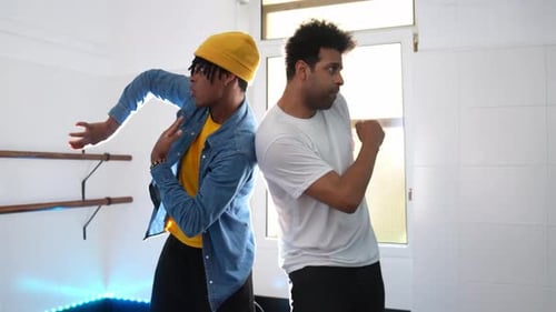 Energetic Afro Hip Hop Dancers Performing in a Studio