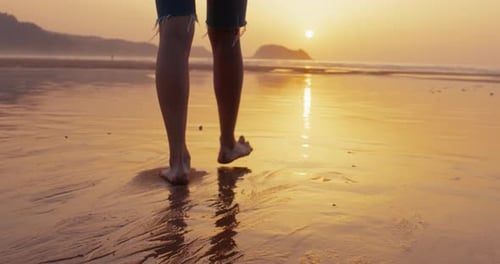 Young and Free Woman Run Towards Ocean at Sunset