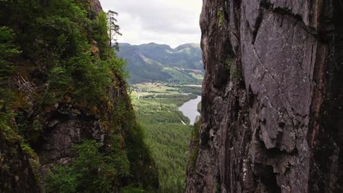 Rocky Cliffs Framing Scenic View Of Mountain Forest And River