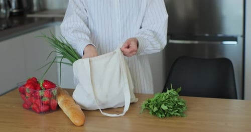 Groceries Hauled Out of Bag in Kitchen