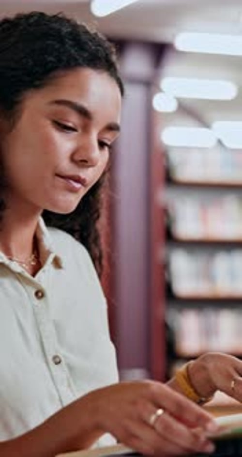 Woman, student and reading book in library for education, knowledge and information on project