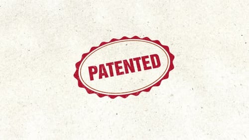 Patent Stamp Reveal on Textured Paper Background