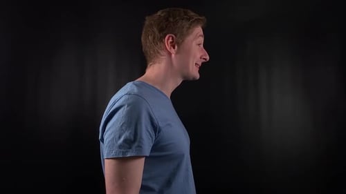 Man in blue t-shirt clapping hands