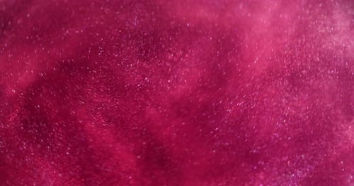 Swirling Red Glitter Particle Abstract Background