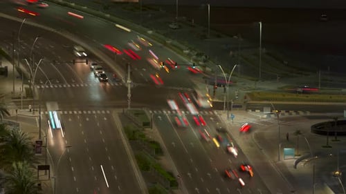 Busy Abu Dhabi, UAE city traffic intersection - nighttime traffic flow timelapse