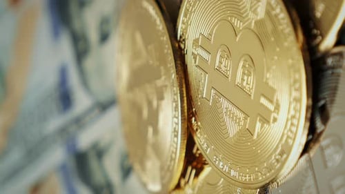 Close Up of Bitcoins and US Dollar Currency