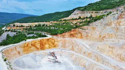 Natural Quarry is Located Near Road Against Backdrop of Rhodope Mountains and Hills with Forests and