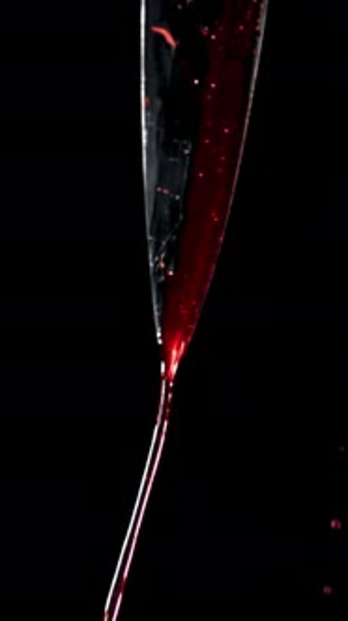 Blood Dripping From the Knife Blade Filmed on a Highspeed Camera at 1000 Fps