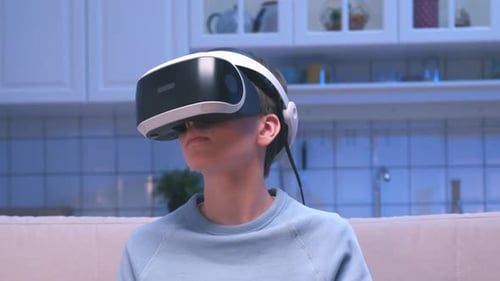 Portrait Boy Uses Virtual Reality Glasses Looking Learning. Facility Helmet for Simulation