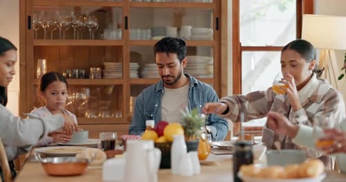 Multigenerational Family Shares Meal at Home