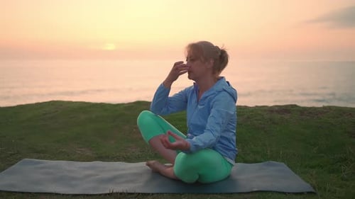 Senior Woman Meditating Doing Breathing Exercises