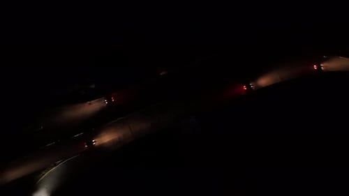 Aerial View Of Dartmouth Dark Road Junction With Car Headlights Lighting The Way