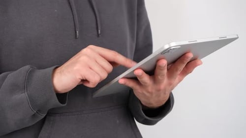 Man Using Tablet Device Close-Up