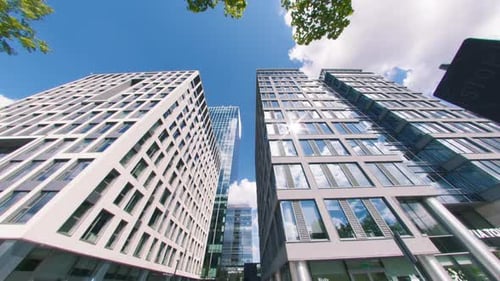 Time Lapse of Skyscrapers and Clouds Reflected in Office Windows