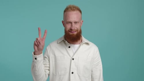 Man Gives Peace Sign in Studio