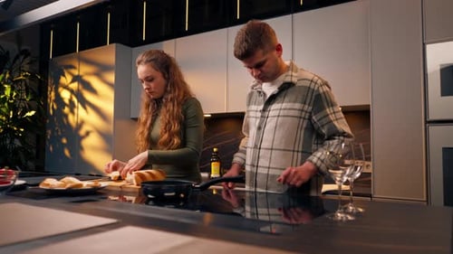 Couple Preparing Food Together in Modern Kitchen