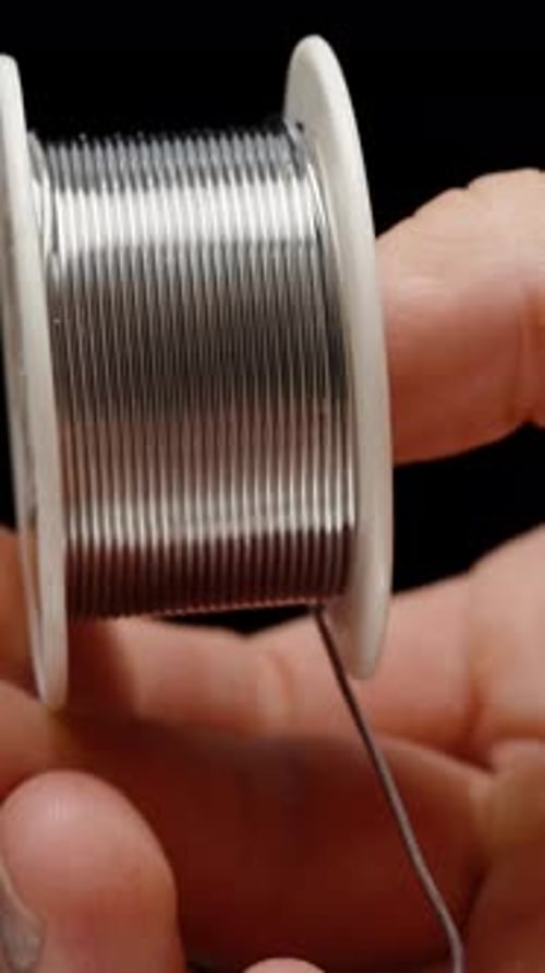 Close Up of Solder Wire Being Pulled