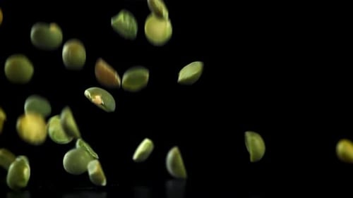 Green Peas Fall on the Table Filmed on a Highspeed Camera at 1000 Fps