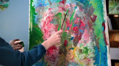 Artist Painting Abstract Artwork in Studio