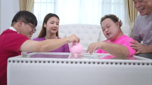 Three siblings save money by putting it in a piggy bank